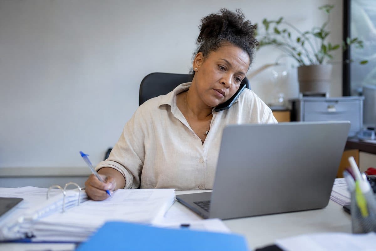 Business owner reviewing multiple vendor support tickets